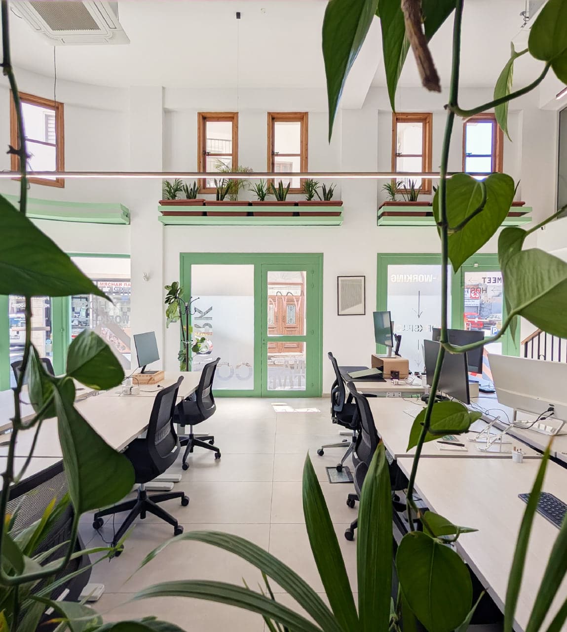 View of the main coworking area from the kitchen
