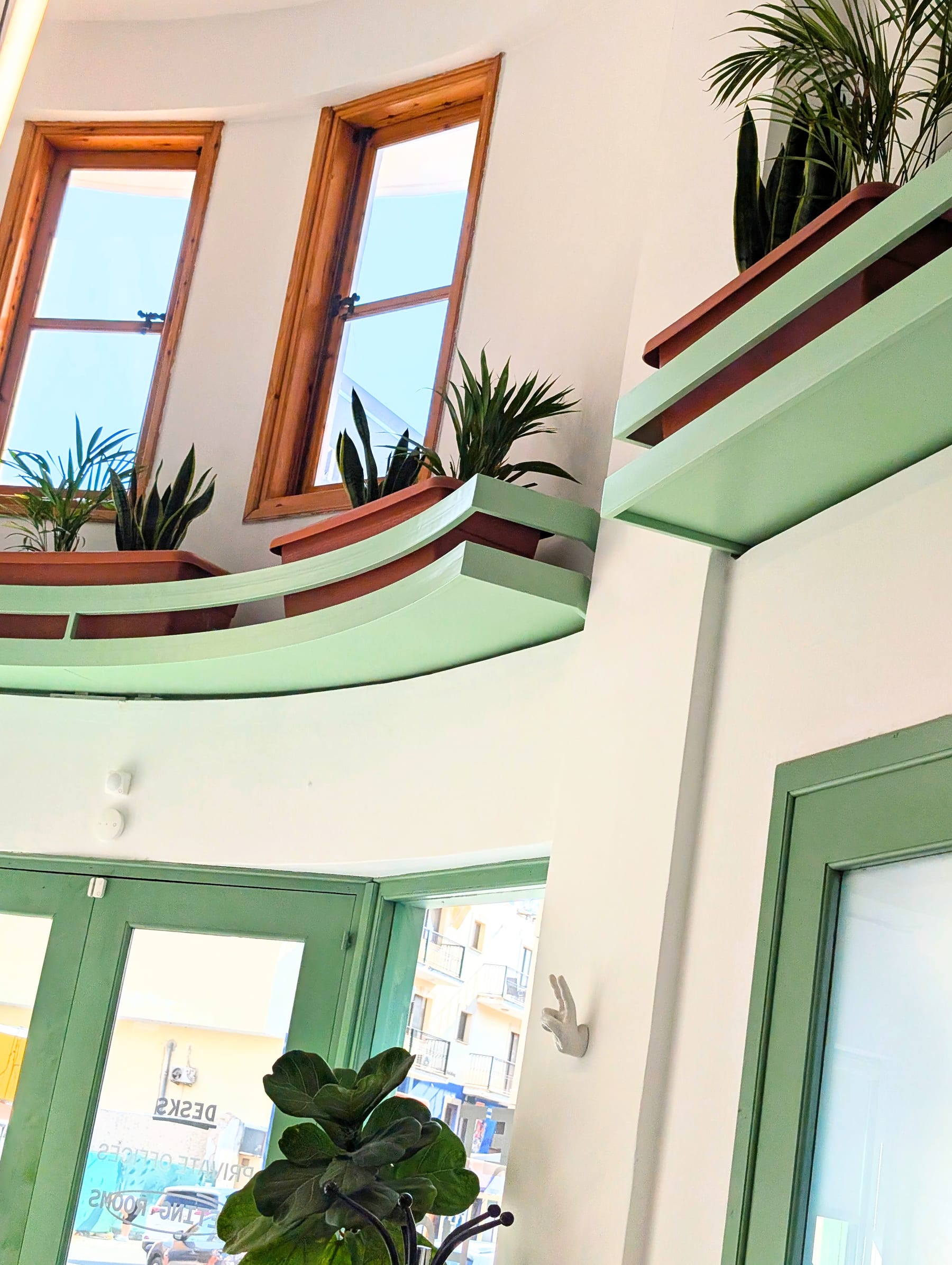 Plant-lined staircase inside Native coworking